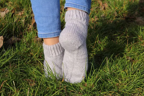 woman in warm knitted socks