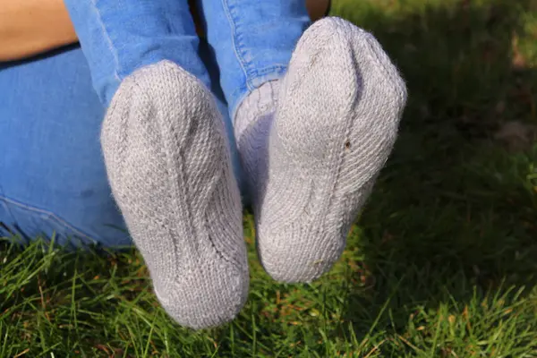 woman feet in blue socks.
