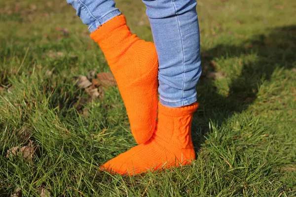orange socks in the female legs