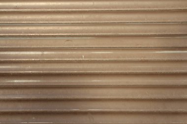 kahverengi kıvrımlı metalin arkaplanı