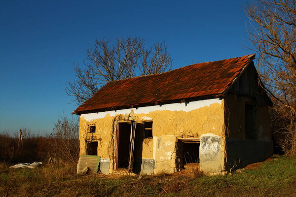 a small house with a broken roof