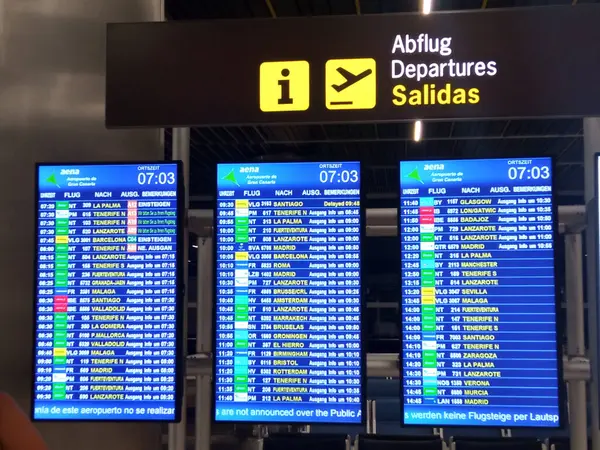 Illuminated sign informing the departure of flights at the airport
