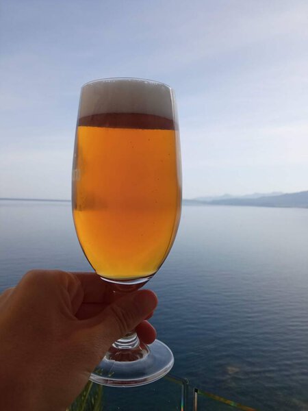 Glass of beer with the sea in the background
