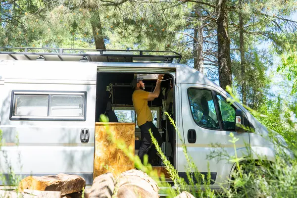 stock image Man customizing a camper van