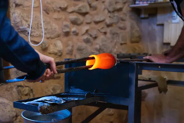 stock image Artisans making a blown glass vase in a workshop