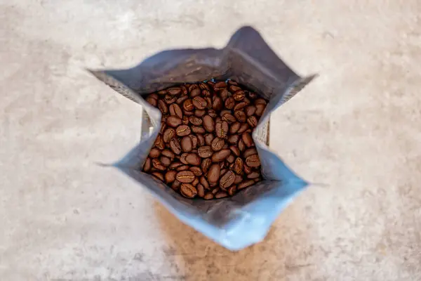 Coffee beans bag on grey background