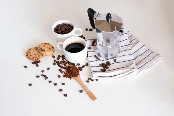 Coffee set of espresso boiler with grounded and beans of coffee on white background