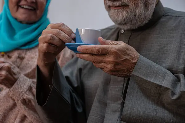 Arabic old couples drinking coffee together