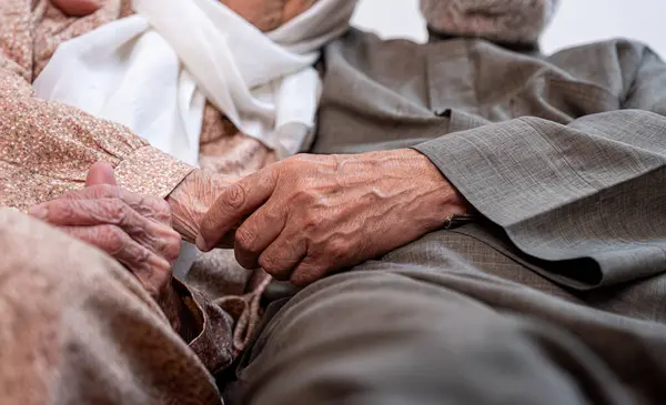 Arabic old couples love each other while holding their hands