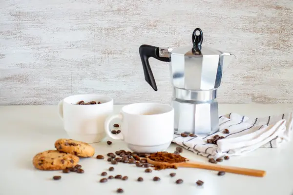 Coffee set of espresso boiler with grounded and beans of coffee on white background