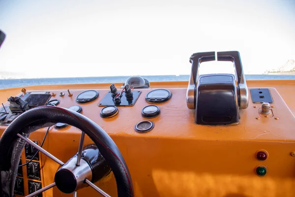 boat control panel with blue sky and orange color