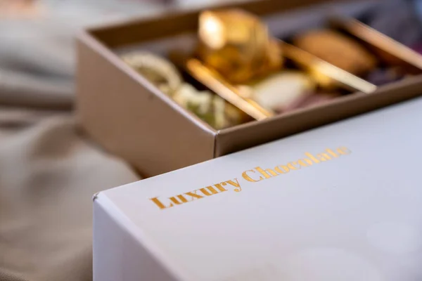 Chocolate box with golden words luxury chocolate  with mock up space and word in arabic, translation: Ramadan kareem