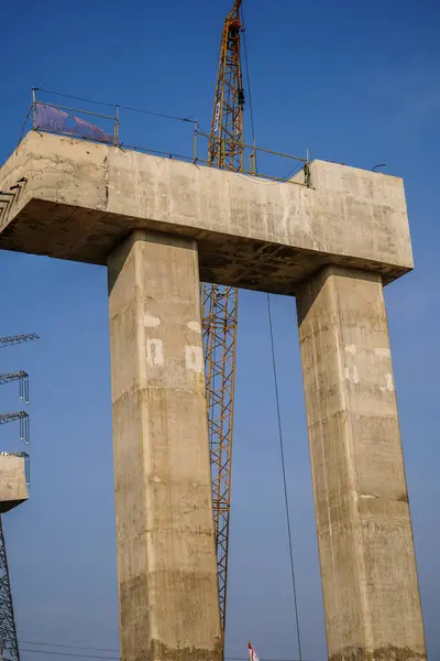 stock image The supporting pillars for the electric train line are still under construction.