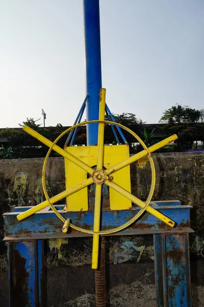 stock image close-up of the steering wheel to open the water dam