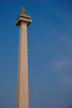 jakarta, august 17, 2024, close up view of the building with the shape of a burning fire torch, close up view of the indonesian national monument. clipart