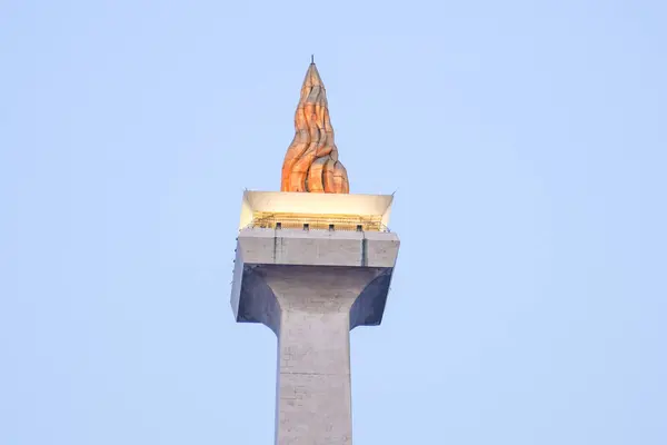 stock image jakarta, august 17, 2024, close up view of the building with the shape of a burning fire torch, close up view of the indonesian national monument.