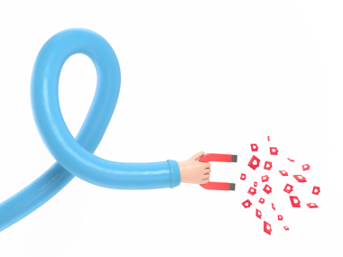 Kırmızı mıknatıs tutan bir el.