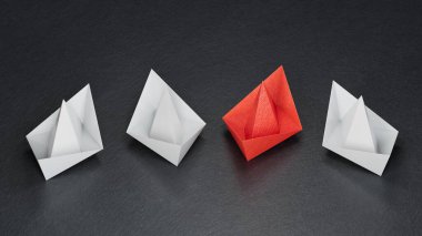 Farklı iş anlayışı. Yeni fikirler. Kağıt sanatı. Origami kağıt tekne filosu. Takım çalışması kavramı siyah arkaplan üzerinde 3D görüntüleme.