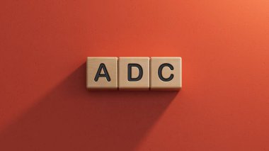 Adc yazılı ahşap küp. Finansal, pazarlama, ahşap unsurların kapatılması, kırmızı arka planda 3D İş Konsepti.