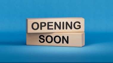 Yakında açılacak sembol. Sözcük yakında tahta bloklarda açılacak. İş ve Açılış yakında. Boşluk 3D görüntülemesini mavi arkaplana kopyala.