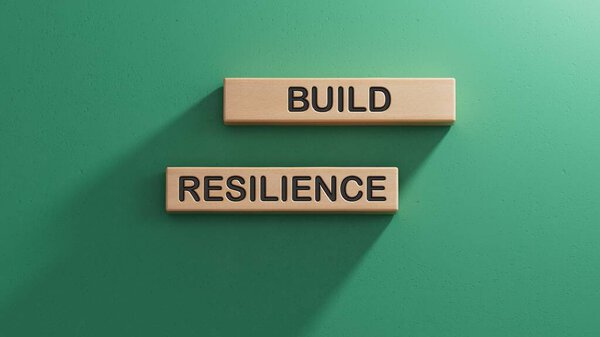 Build resilience symbol. Wooden blocks with words Build resilience. Business and Build resilience concept.3D rendering on green background.