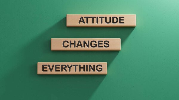 Wooden blocks with words Attitude Changes Everything. Wooden cube blocks. Copy space.3D rendering on green background.