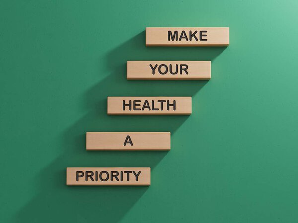 Символ здоровья. Деревянные блоки со словами Сделать ваше здоровье Priority.Health концепции. Копирование пространства. 3D рендеринг на зеленом фоне.