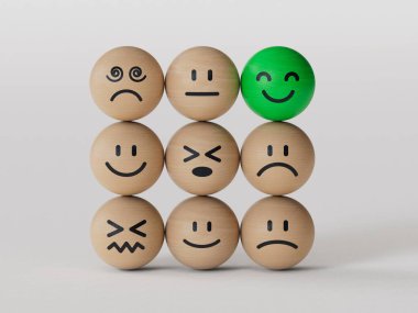 Creative idea and smart people, unique, difference, leadership, solutions and motivation concepts. Happy smile face BALL on wooden BALL block stack with other dumb faces on white background.
