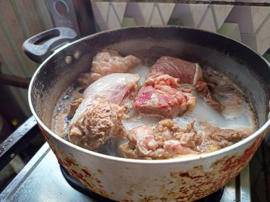 Boil the beef to make it softer clipart