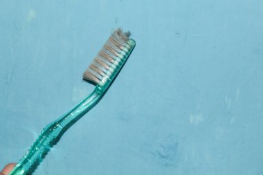 Dirty toothbrush, no longer used clipart