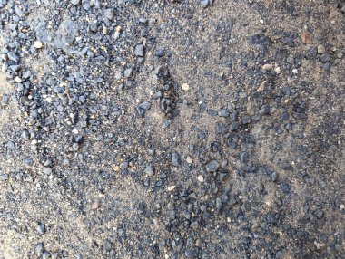 Kum ile karıştırılmış küçük çakıl taşlarının soyut arkaplanı