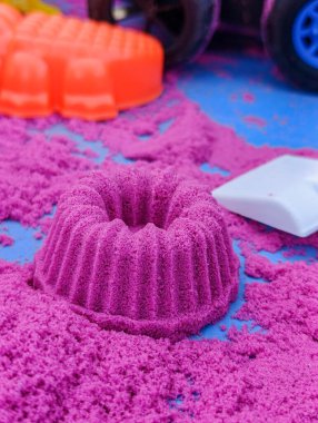 Children's toy sand in the shape of a pudding cake clipart