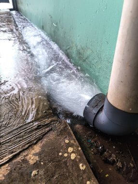 Long exposure to the water coming out of the pipe clipart