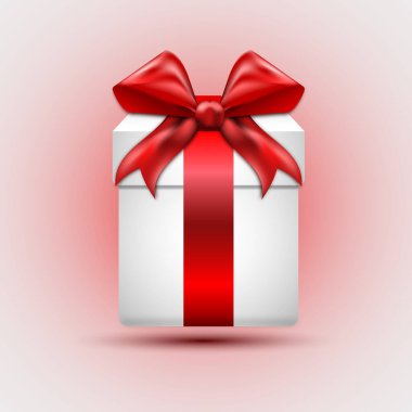 Kırmızı kurdeleli beyaz bir bayram hediyesi.