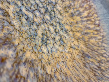 Dalga şeklinde bir deseni olan taşın soyut arkaplanı