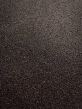 Asfalt yol yüzeyinin yakın çekim görüntüsü. Tasarım için soyut arkaplan ve doku.