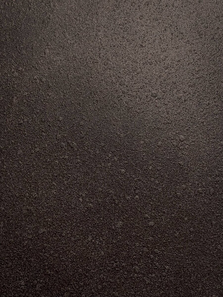 Крупный план текстуры поверхности асфальтовой дороги. Абстрактный фон и текстура для дизайна.