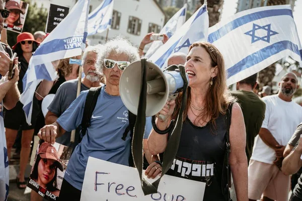 stock image Tel Aviv, Israel - October 1 4, 2 0 2 3: spontaneous rally near the Ministry of Defense building, protesting against the government and for the release of kidnapped Hamas hostages at any cost. Horizontal