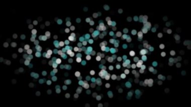 Canlandırılmış cyan ve beyaz soyut bulanık parçacıklar yavaşça siyah arkaplan üzerinde hareket ediyor