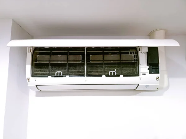Open the home air conditioner cover.
