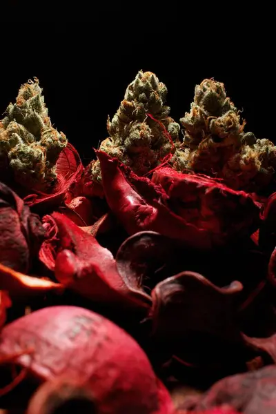 Cannabis Sitting Atop Roses — Stock Photo, Image
