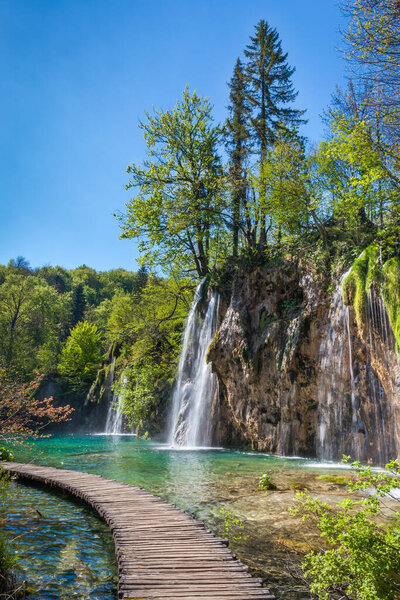 Beautiful waterfalls plunging in emerald, crystal clear lakes, Plitvice National Park, Croatia