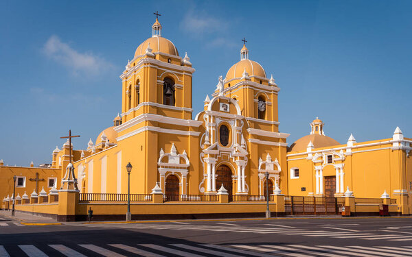 The grand cathedral with its bright yellow shade and white ornaments, Trujillo, Peru