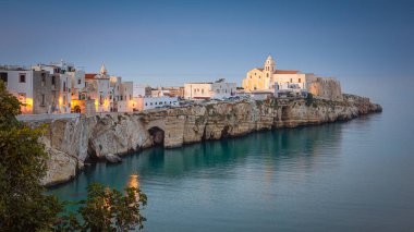 Scenic view of Vieste with the church of San Francesco, Gargano, Puglia, Italy clipart