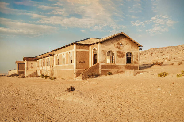 Abandoned hospital building (krankenhaus) in Kolmanskop, Namibia. It was very modern at its day and had the first X-ray machine of the southern hemisphere, mainly to detect the smuggling of diamonds.