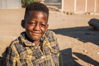 Portrait of smiling teenager in Katutura, Windhoek, Komas Region, Namibia. Katutura is a township created in the 1950s to segregate the black population of Windhoek. clipart