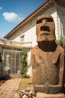 Moai statue from Easter Island (Rapa Nui) in front of Fonck Museum in Vina del Mar, Chile. The museum boasts an interesting collection of archaeological finds from Easter Island. clipart