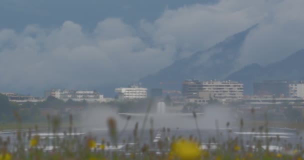Slow Motion Jet Airplane Takeoff Framed Mountainous Landscape — Stock Video