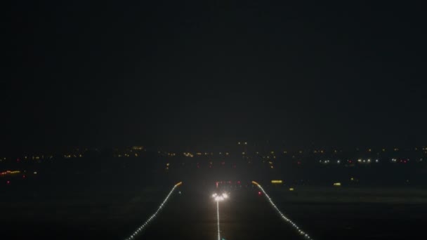 Airplane Lit Navigation Landing Lights Ascends Dark Sky Runway Takeoff — Stock Video