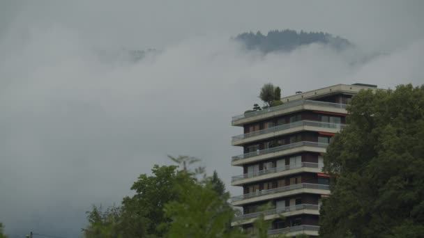 Apartment Building Roof Garden Stands Foreground Fog Covered Hills Trees — Stock Video
